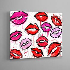 a painting with red and pink lipstick on it