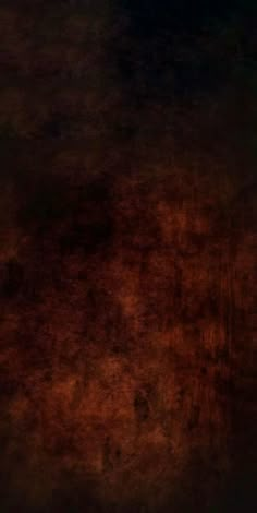 an orange and brown background with black spots