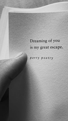 a person holding up a piece of paper with the words dreaming of you is my great escape