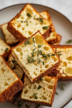 several slices of bread on a plate with herbs