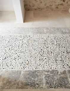 a white toilet sitting on top of a tiled floor