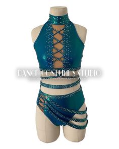 a woman's dance costume with straps and beading on the bottom, in blue