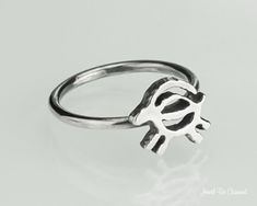 "This sterling silver ring features a goat, it is a simple running outline of a goat done in a Native American petroglyph style! I create these rings by hand, measuring, soldering and shaping the ring base first from sturdy 14 gauge round wire, then permanently soldering the accent piece on. Each ring will be a bit different due to their handmade nature. All components are solid .925 sterling silver. The ring could be a charming piece of jewelry for yourself, or for a special person in your life Goat Jewelry, A Goat, Custom Rings, Rings Statement, Accent Pieces, Sterling Silver Ring, Band Rings, Handmade Natural, Statement Rings