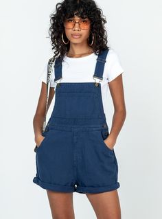 Overalls  100% cotton   Ariel is wearing a size US 4 / AU 8    Denim material  Adjustable buckle straps  Button fastening at sides  Large chest pocket    Classic four pockets   Gold-toned hardware   Fixed rolled hem  Non-stretch   Unlined Trendy Cotton Shortalls With Adjustable Straps, Trendy Cotton Shortalls With Side Pockets, Dark Wash Cotton Shortalls With Pockets, Utility Denim Blue Cotton Shortalls, Casual Cotton Overalls With Belt Loops, Cotton Shortalls With Pockets In Medium Wash, Utility Cotton Overalls With Belt Loops, Utility Style Dark Wash Cotton Overalls, Blue Cotton Utility Shortalls