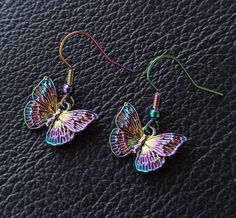 Rainbow Metal Earrings With Ear Wire, Multicolor Butterfly Earrings For Pierced Ears, Hypoallergenic Rainbow Colored Metal Jewelry, Hypoallergenic Rainbow Metal Jewelry, Rainbow Metal Earrings, Hypoallergenic Rainbow Drop Earrings, Rainbow Metal Drop Earrings, Multicolor Butterfly Charm Earrings, Rainbow Hypoallergenic Earrings As Gift