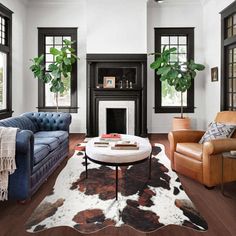 a living room filled with furniture and a fire place