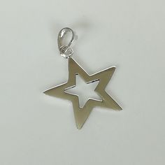 ▪︎ Sterling silver star frame pendant. ▪︎ Size: 18 x 18 mm ▪︎ Can be used as a charm for necklaces, bracelet, keychains, zip pullers etc ▪︎ This pendant is handmade with hypoallergenic sterling silver and marked with a 925 silver stamp. ▪︎ Please note: This pendant comes WITHOUT the chain, however, you can add a snake chain in the required length while making your selection. You can also opt to choose other kinds of chains and bracelet chains from my shop by visiting the links below. ▪︎ All jewe Metal Star Charm Pendant Necklace, Silver Star-shaped Metal Jewelry, Symbolic Sterling Silver Star Charm Necklace, Sterling Silver Star Of David Charms Jewelry, Sterling Silver Charm Necklace With Moon And Star, Sterling Silver Symbolic Necklace With Star Charm, Sterling Silver Star And Moon Charm Necklaces, Star Charm Round Pendant As Gift, Sterling Silver Star Charm Necklace With Moon Charm