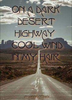 an empty road with the words on it that says, on a dark desert highway cool wind in my hair