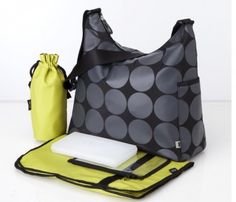 a large gray and yellow polka dot bag next to a laptop, mouse pad and water bottle