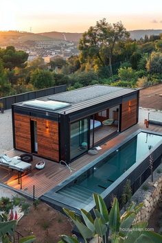 an aerial view of a house with a swimming pool