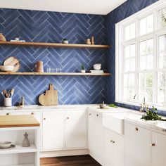 a kitchen with white cabinets and blue tile backsplashing, wooden shelves on the wall