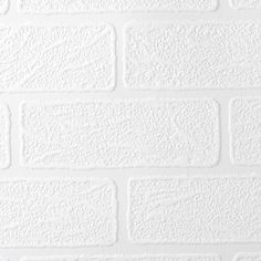 a white brick wall that has been painted