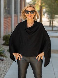 This On Trend Black Pull On Poncho is a must have Knitted in a soft black yarn Yarn content: 50% Viscose, 28% Nylon, 22% Polyester Pull on body Can be worn a few different ways for a stylish modern clean look Versatile Black Soft Knit Sweater, Modern Black Outerwear For Layering, Sleek Stretch Outerwear For Fall, Modern Black Knit Sweater, Chic Poncho For Layering, Modern Oversized Black Sweater, Chic One-size Poncho For Layering, Versatile Black Sweater For Winter, Chic Knit Stretch Outerwear