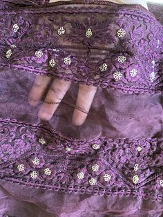 This is a semi-sheer, soft, and fluffy plum organza fabric.  It has plum (tone to tone) embroidered floral motifs all over the fabric in parallel rows. Each parallel row of embroidered motifs is about 3 inches wide. The intricate embroidery has been done in soft silk threads. The embroidery has been further embellished with muted gold sequins. The sequins are sewn in the shape of small flowers. Sequins are sewn (not pasted), so will not fall off with use. All four edges are hemmed with silk thre Embroidered Motifs, Organza Fabric, Intricate Embroidery, Fabric Remnants, Gold Sequins, Silk Thread, Bridal Veil, Floral Motifs, How To Make Bed