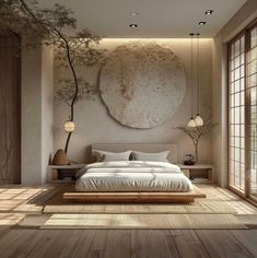 a bedroom with wooden floors and a large round painting on the wall above the bed