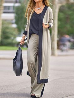 This incredibly versatile outfit features a sleeveless camisole top, a long-sleeved cardigan jacket, and a pair of loose-fitting trousers. For women who appreciate a style featuring a contrast of colors, this is a great outfit that can be worn out and about or as at-home loungewear. They're also favorites as sleepwear. The luxury feel of the polyester fabric makes this three-piece ensemble ultra comfortable. At the same time, it's also durable and works with your body, thanks to the slight spand 3 Piece Suit Women, Pant Suits For Women, Mode Kimono, Womens Office, Pantsuits For Women, Casual Cardigans, Three Piece Suit, Indie Outfits, Pantalon Large