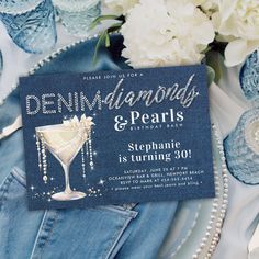 a blue and white wedding card with the words, diamonds & pearls on it next to some flowers