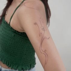 a woman with a tattoo on her arm