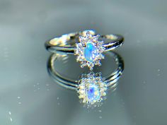 🚚 Free Shipping on Orders Over $35 🌸 Natural Opal Floral Design Ring, Vintage-Inspired Aquamarine Wedding/Anniversary Ring, Adjustable Solitaire Ring, Elegant & Cute Bridesmaid Jewelry, Silver Plated Embrace the beauty of nature with our Natural Opal Floral Design Ring. This exquisite ring features a stunning opal gemstone, beautifully set in a charming floral design that captures the essence of vintage elegance. Perfect for weddings, anniversaries, or as a thoughtful gift for bridesmaids, this ring is a delightful addition to any jewelry collection. 🌸✨ Key Features: 🌼 Vintage Floral Design: The ring's unique flower-inspired design exudes a sense of charm and romance. Its delicate petals gracefully embrace the opal gemstone, creating a stunning focal point that celebrates nature's beau Aquamarine Wedding, Wedding Anniversary Ring, Ring Elegant, Vintage Floral Design, Wedding Anniversary Rings, Unique Flower, Vintage Elegance, Unique Flowers, Multi Stone Ring