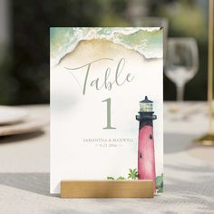 a table card with a lighthouse on it and a wine glass next to it that says table 1