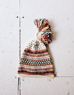 A vintage 1970s hand knit fair isle wool pom pom hat. *label: n/a *hat is wool *excellent condition! *No size tag. Hat opening measures 17 1/2"-20" / 44.5 cm-51 cm (flat-stretched) in circumference. Hat measures 9 1/4" / 23.5 cm opening to top of hat. RETURN POLICY: Please be aware that while I do accept returns, I accept them *only* when the item does not match my description. I do NOT accept returns for items that do not fit. HOW SIZING WORKS: Sizing varies greatly era to era, manufacturer to manufacturer, and even garment to garment. I provide a modern day *estimate* of the size of vintage garments in my shop, but the best way to determine fit is to compare the measurements given in the description with those of a similar style garment that does fit. more vintage accessories || https:// Beanie Pom Pom, Wool Beanie, Pom Pom Hat, Vintage Accessories, Fair Isle, Vintage Shops, Hand Knitting, Caps Hats, Accessories Hats