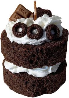 a chocolate cake with whipped cream and pretzels on top is shown in this image