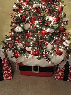 a decorated christmas tree with presents under it