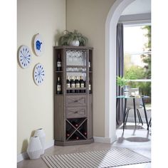 a tall wooden cabinet filled with bottles of wine