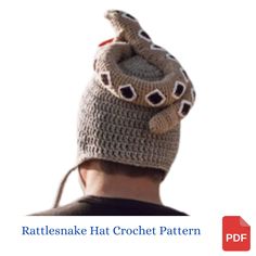 a man wearing a knitted hat with an elephant on it's head and the words rattleshake hat crochet pattern