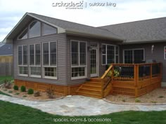 a house with sunrooms on the porch