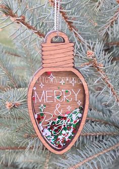 a wooden ornament hanging from a tree with merry and bright decorations on it