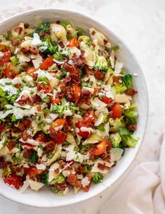 a white bowl filled with salad on top of a table