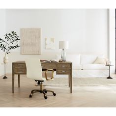 a white chair sitting in front of a wooden desk