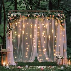 an outdoor wedding setup with flowers and lights