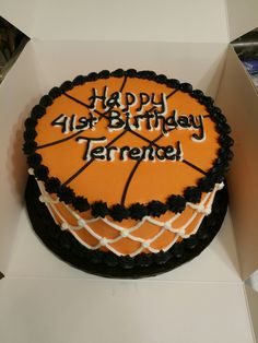 a birthday cake with an orange and black basketball on it