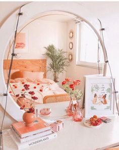 there is a bed in the mirror with flowers on it