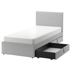 a bed with two drawers underneath it and a white headboard on the bottom shelf