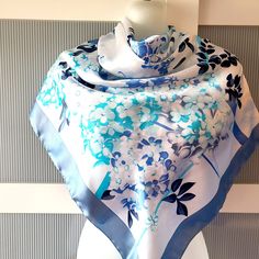 Beautiful and elegant blue silk satin scarf with a gorgeous floral design of cherry and lilac blossom. The scarf combines various shades of blue -  baby blue, powder blue and navy blue on a white background. The scarf has a beautiful sheen. The scarf is large square and can be used as a neck wrap, head cover. hair tie, headband, bag decor, etc. The scarf is marked Kevser Collection. It is in excellent/mint condition and will make a beautiful gift for any occasion! The scarf comes in a gift wrap and with a 'Thank you' card. For more scarves in my store visit: https://www.etsy.com/ca/shop/NostalgicByLiliya?ref=seller-platform-mcnav&section_id=25031148 For other items visit: https://nostalgicbyliliya.etsy.com Blue Elegant Rectangular Silk Scarf, Elegant Blue Rectangular Silk Scarf, Blue Silk Scarf For Spring, Blue Satin Silk Scarf As Gift, Blue Satin Silk Scarf For Gift, Elegant Blue Silk Scarf For Spring, Spring Blue Floral Print Silk Scarf, Elegant Blue Silk Scarf For Wedding, Elegant Blue Satin Silk Scarf