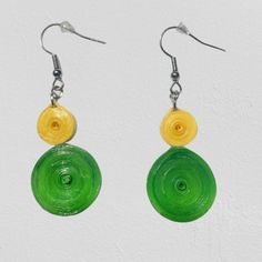 pair of green and yellow earrings on white background