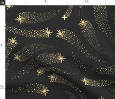 a black and gold wallpaper with stars in the night sky, on top of a ruler