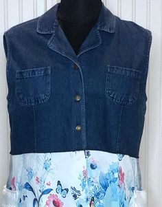 This one of a kind Women's XL denim duster vest is a combination of several upcycled  pieces.  The XL dark denim vest has been upcycled with the addition of a beautiful white on white polyester panel in the center back skirt and a flower and butterfly in blue on white polyester skirt.  The skirt has multiple gathered panels and is softly flowing.  Notice the center back of the Vest has the butterfly material inset with a special free standing lace black butterfly on top. This inset allows more freedom of movement and flow.  There are also two large side pockets.  Wear this great piece over jeans with your boots or slip on your dancing shoes and kick up your heels. You will get many compliments when you wear this denim duster. Dress it up or wear it for casual. It's fits in anywhere.  Fully Sleeveless Patchwork Denim Vest For Summer, Summer Sleeveless Patchwork Denim Vest, White Denim Vest For Spring, Summer Patchwork Denim Vest, Spring Patchwork Denim Vest In Blue, Summer Denim Patchwork Vest, Summer Sleeveless Denim Vest With Patchwork, Casual Upcycled Denim Vest For Spring, White Denim Vest For Summer