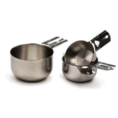 two stainless steel pots and pans with tongs on the side, one being used for cooking