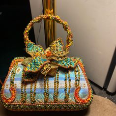 Beautiful Vintage Mary Frances Purse It Is Stunning And In Good Condition. Multicolor Top Handle Evening Bag, Handmade Multicolor Evening Bag For Formal Occasions, Designer Orange Bags As Gifts, Designer Orange Bags For Gifts, Elegant Multicolor Top Handle Evening Bag, Multicolor Handheld Bag For Formal Occasions, Luxury Multicolor Handheld Clutch, Handmade Multicolor Formal Bags, Multicolor Evening Bag With Detachable Handle