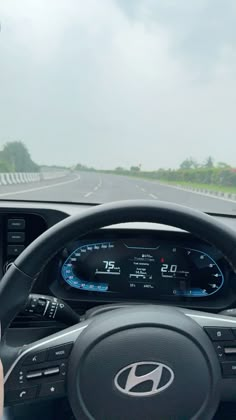 the dashboard of a car on a highway