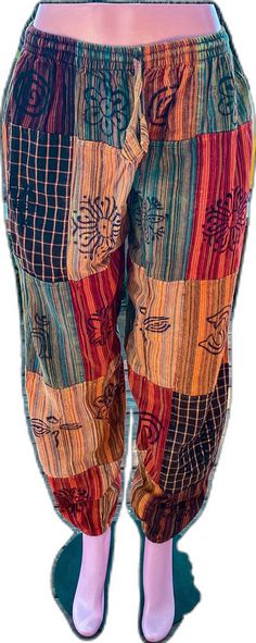 Casual Patchwork Pants For Festival, Casual Festival Pants With Patchwork, Casual Multicolor Patchwork Pants, Multicolor Cotton Bottoms With Floral Patchwork, Multicolor Floral Patchwork Bottoms For Festival, Hippie Multicolor Bottoms With Elastic Waistband, Patchwork Boho Pants, Multicolor Patchwork Festival Bottoms, Hippie Cotton Bottoms With Floral Patchwork