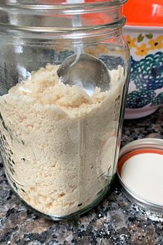 a glass jar filled with food sitting on top of a counter