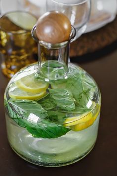 a glass bottle filled with water and lemon slices