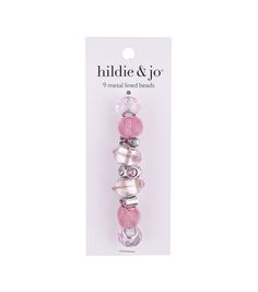 a package of pink and silver beads