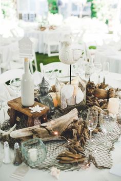 an image of a table setting with wine glasses and candles