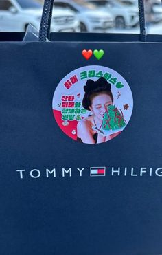 there is a bag with a sticker on it that says tommy hilfiger